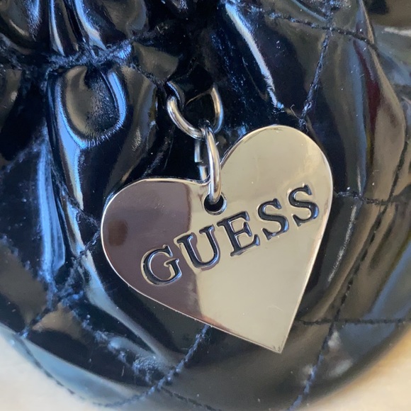 11:01  - 3/$25 Bundle Only GUESS Patent Drawstring Pouch - Picture 4 of 11